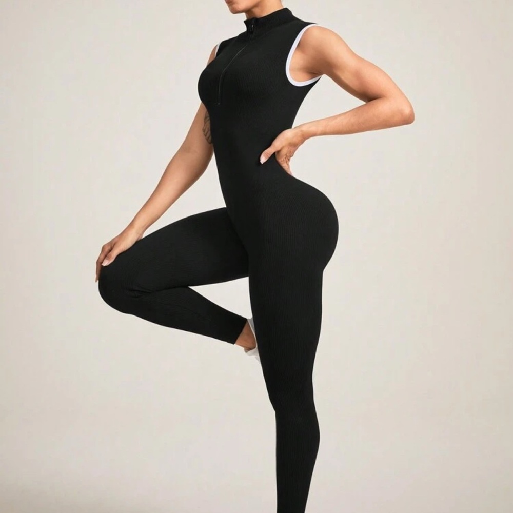 Sleek Black Form-Fitting Jumpsuit with Mock Turtleneck and Sleeveless Design